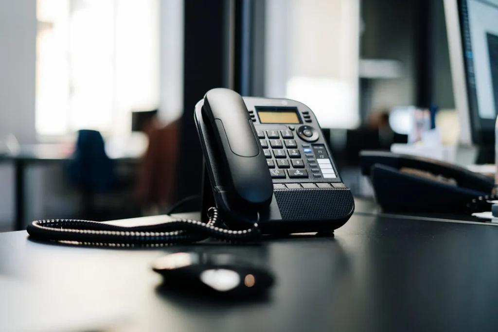 Office desk phone representing client inquiry support and billing admin calls for accounting practices